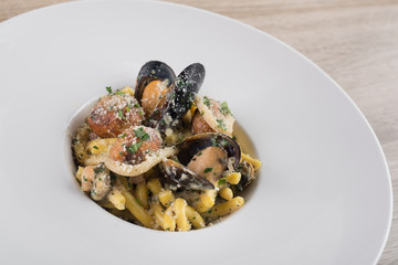 pasta with mussels on a white plate