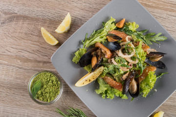 Fresh salad with mussels and lemon