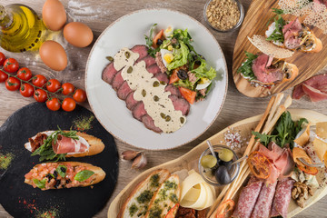 Snack table from bruschetta with tomatoes and mushrooms