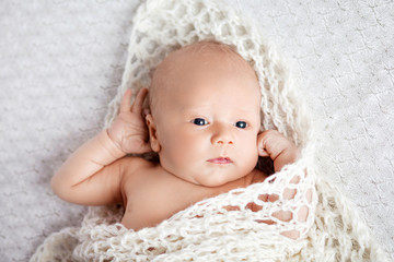 Newborn baby with open eyes.  Portrait of pretty newborn boy  20 days old