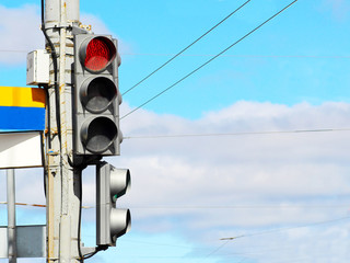 Traffic light against blue sky background
