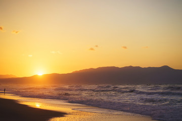 Walk on the beach during a beautiful magical sunset. 