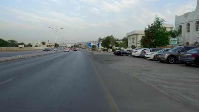 View driving on the city of Muscat Roads, Oman, Middle East, GCC  Vehicle point-of-view driving on Muscat Coastal highway beach road Azaiba and Ghubra