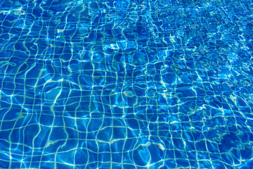 Water abstract background, Swimming pool rippled.Under water tile of swimming pool floor.