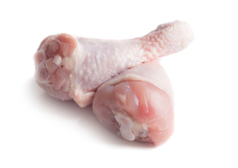 Raw chicken legs on white background