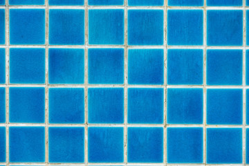 Blue tiles on the bottom of the pool.