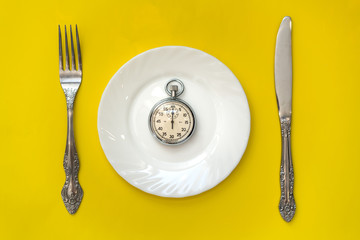 Lunch time concept. Clock with knife and fork