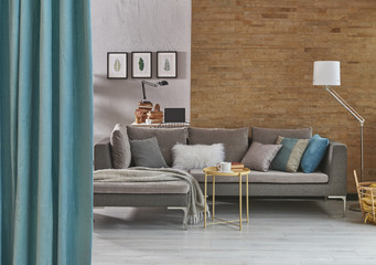 modern living room style concrete grey wall and brick wall background blue curtain