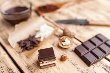 Delicious chocolate on wooden background