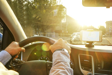 Directions on cell phone in phone holder mount on dashboard dash panel surface, expensive vehicle...