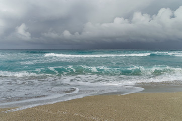 Fototapeta na wymiar storm on the Atlantic coast, beach patch, waves, foam, low clouds over the ocean, Varadero Cuba
