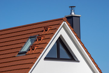 part of a new house with roof and facade