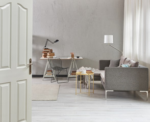 grey living room working area and white door