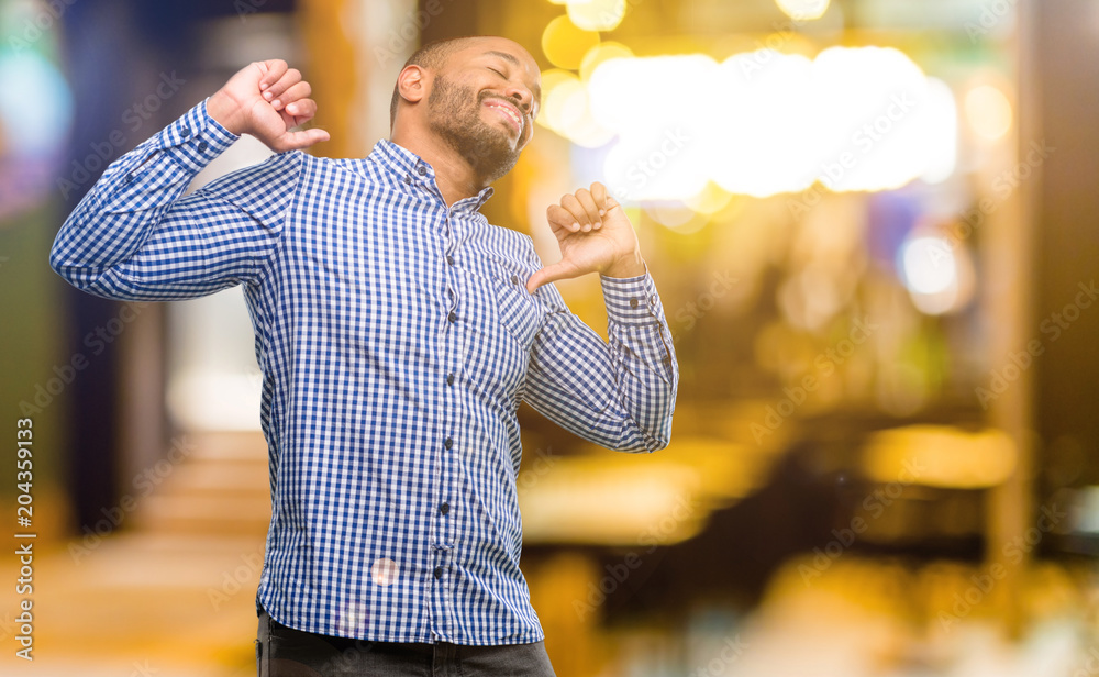 Poster African american man with beard confident and happy with a big natural smile laughing at night