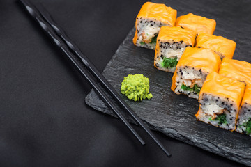 Fresh sushi on a black slate