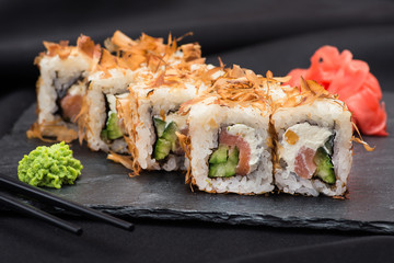 Fresh sushi on a black slate