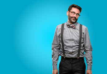 Middle age man, with beard and bow tie making funny face fooling