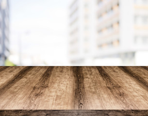 Wooden empty table board in front of blurred background. Can be used for display or montage any product. Mock up for display your product.