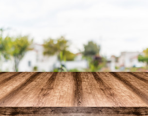 Wooden empty table board in front of blurred background. Can be used for display or montage any product. Mock up for display your product.