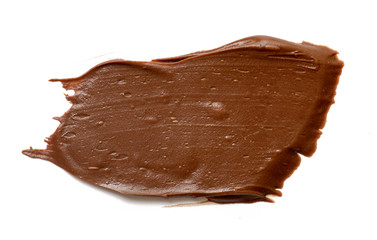 Cream chocolate spreading isolated over white backround. Food background for your design