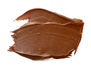 Cream chocolate spreading isolated over white backround. Food background for your design