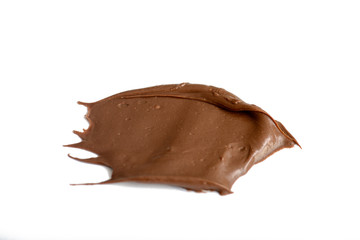 Cream chocolate spreading isolated over white backround. Food background for your design