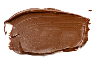 Cream chocolate spreading isolated over white backround. Food background for your design