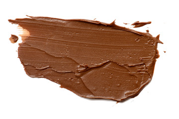 Cream chocolate spreading isolated over white backround. Food background for your design