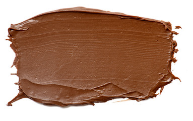 Cream chocolate spreading isolated over white backround. Food background for your design