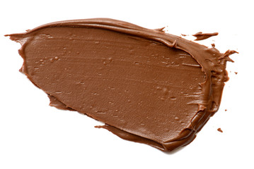 Cream chocolate spreading isolated over white backround. Food background for your design