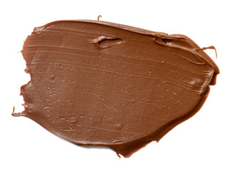 Cream chocolate spreading isolated over white backround. Food background for your design