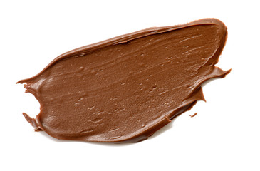 Cream chocolate spreading isolated over white backround. Food background for your design