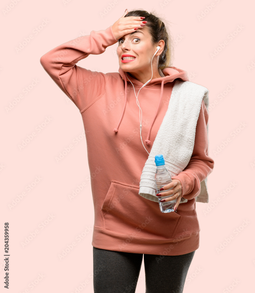 Canvas Prints Young sport woman wearing workout sweatshirt terrified and nervous expressing anxiety and panic gesture, overwhelmed