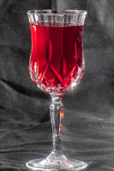 bright red wine in crystal glass