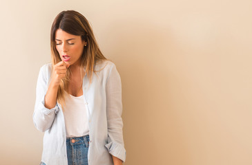 Vintage photo of a Beautiful woman against wall sick and coughing, suffering asthma or bronchitis, medicine concept