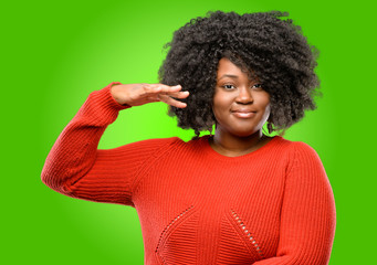 Beautiful african woman holding something, size concept