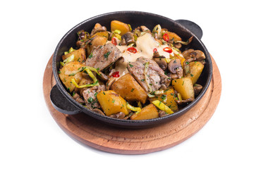 Meat hot frying pan with potatoes, vegetables