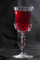 full crystal glass of red wine