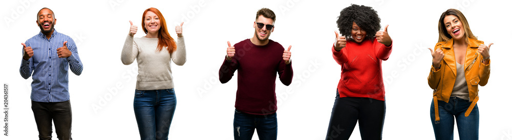 Wall mural Group of cool people, woman and man smiling broadly showing thumbs up gesture to camera, expression of like and approval