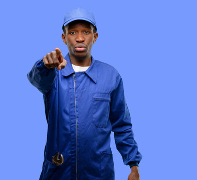 African black plumber man pointing to the front with finger