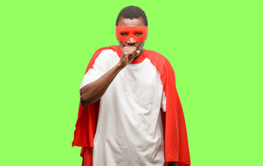 Obraz premium African black super hero man sick and coughing, suffering asthma or bronchitis, medicine concept