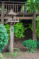 The old wooden joss house or shrine of the household god in Thailand