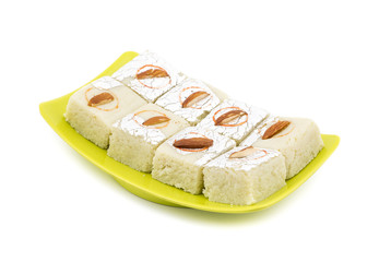 Indian Sweet Food Badam Barfi Also Know As Mithai, barfee, Mawa Barfi, Mava barfi, Almond Sweet, khoya Burfi Indian Popular Sweet Made up of Coconut, Mawa, Milk and Sugar isolated on white background