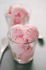 Strawberry ice cream scoops in glass