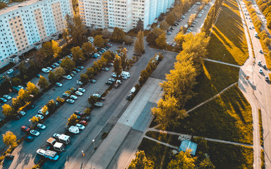 Aerial view of a parking lot and cars above a road © Novanture