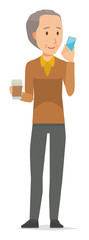 An elderly man wearing brown clothes has coffee and manipulating a smartphone