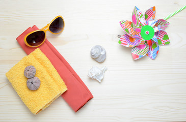 Flat lay image of accessory clothing women to plan travel in holiday, wooden background concept.
