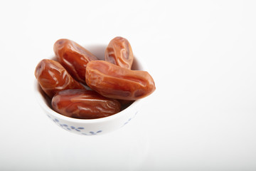 Dates isolated on white background. Food for ramadan