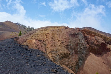 Obraz premium At the edge of a volcano in La Palma island, hiking trail GR131 Ruta de los Volcanes, Canary islands, Spain