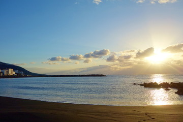 Fototapeta na wymiar Colorful sunrise on the beach of capital city Santa Cruz de la Palma, Canary Islands, Spain